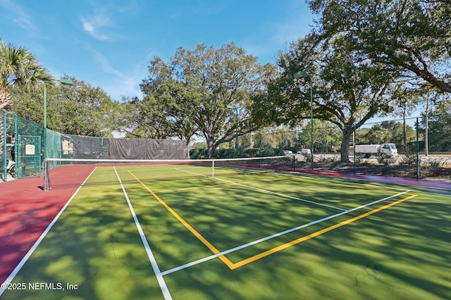 view of sport court featuring basketball hoop