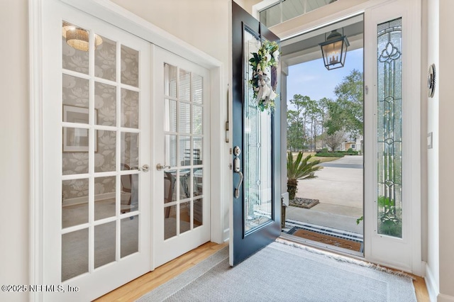 doorway to outside with hardwood / wood-style flooring and french doors