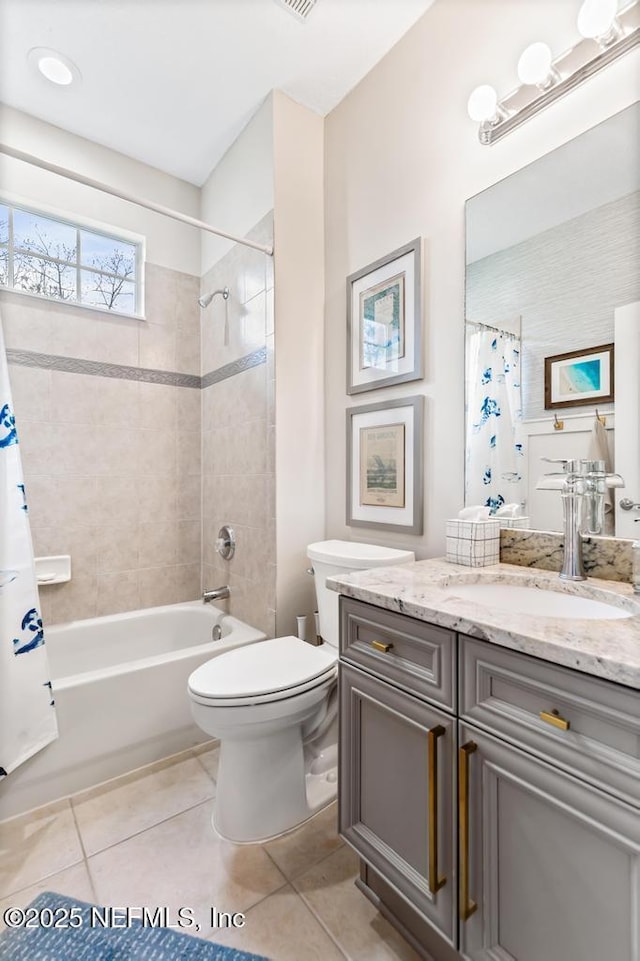 full bathroom with shower / bathtub combination with curtain, vanity, tile patterned floors, and toilet