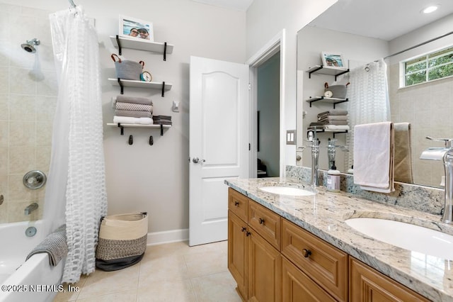 bathroom with shower / bathtub combination with curtain, vanity, and tile patterned floors