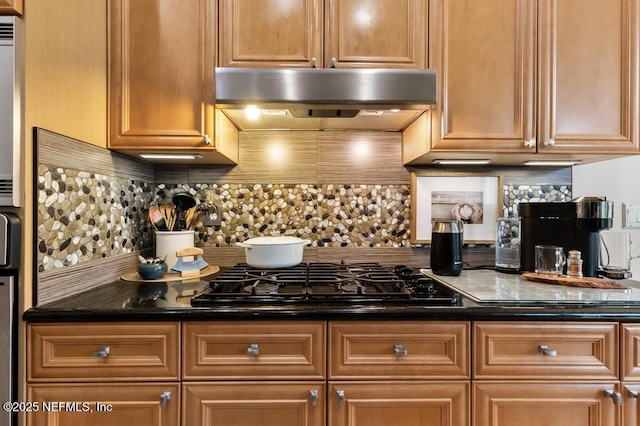 kitchen featuring black gas cooktop and decorative backsplash