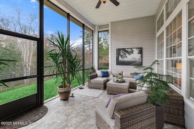 sunroom / solarium with ceiling fan