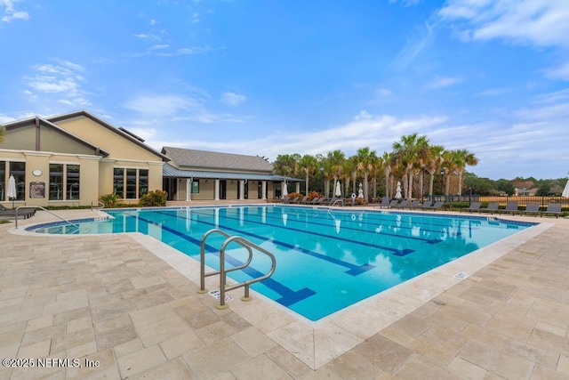 view of swimming pool with a patio