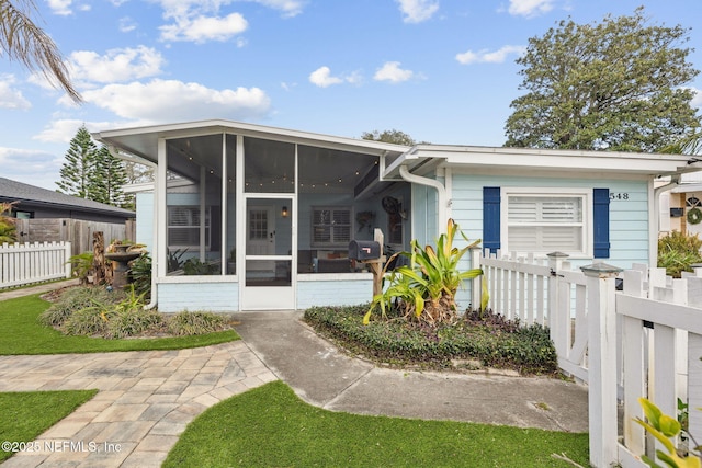 view of front facade with a sunroom