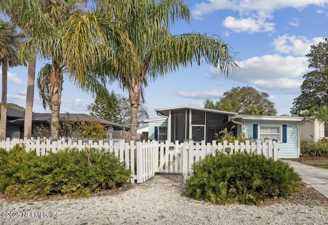 view of front of property featuring a sunroom