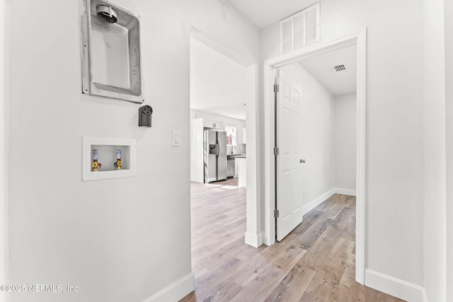 hallway featuring light hardwood / wood-style flooring