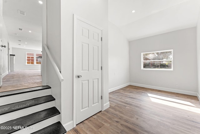 staircase with wood-type flooring