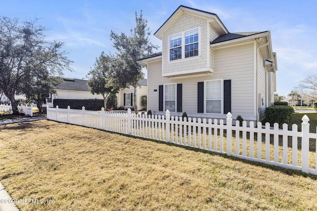 view of front facade with a front yard