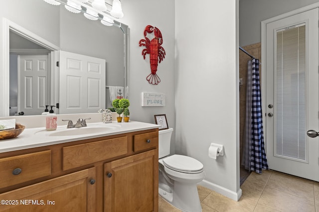 bathroom featuring an inviting chandelier, vanity, toilet, and tile patterned flooring