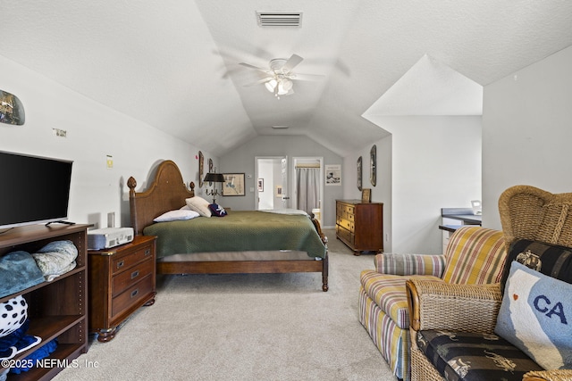 carpeted bedroom featuring vaulted ceiling, ceiling fan, and ensuite bathroom