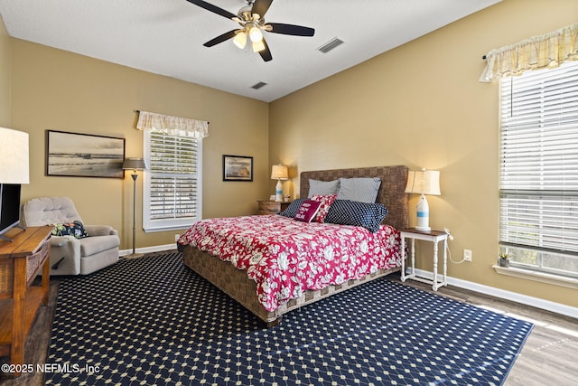 bedroom featuring ceiling fan and hardwood / wood-style floors