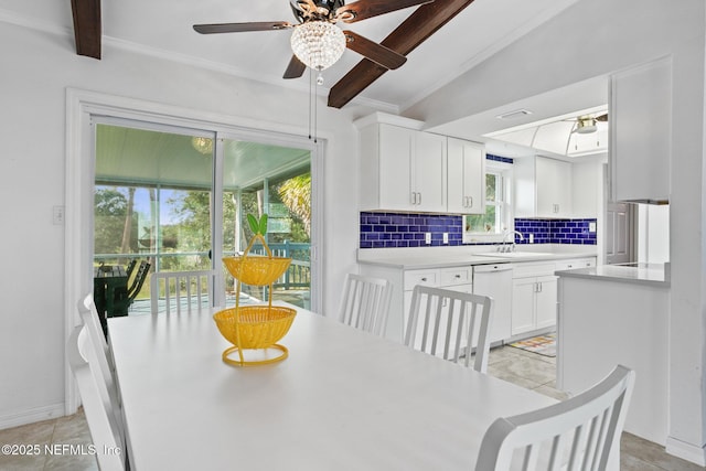 dining area with sink, vaulted ceiling with beams, ceiling fan, and light tile patterned flooring