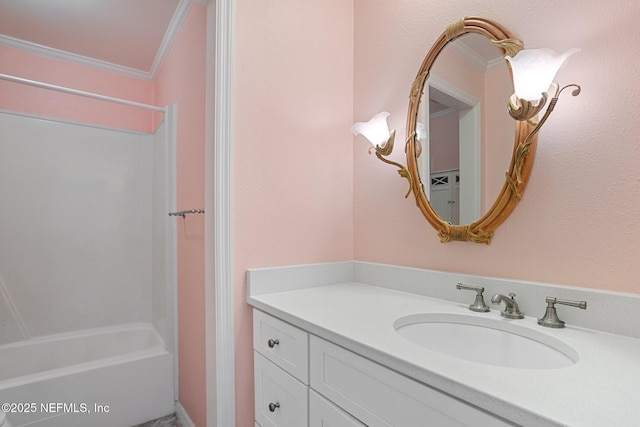 bathroom featuring vanity, crown molding, and shower / bathing tub combination