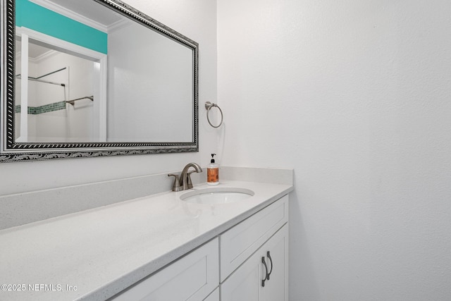 bathroom with crown molding and vanity