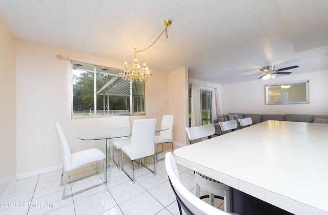 dining area featuring ceiling fan with notable chandelier and light tile patterned floors