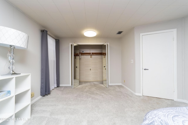 carpeted bedroom featuring a closet