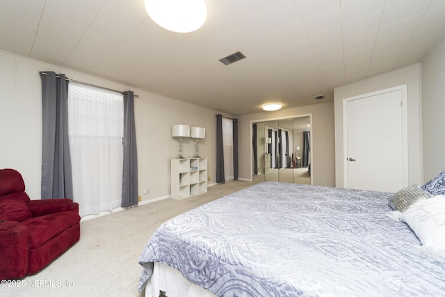 bedroom with light carpet and a closet