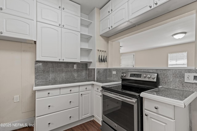 kitchen with open shelves, tile counters, tasteful backsplash, stainless steel range with electric cooktop, and white cabinetry