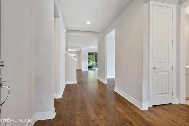 hall featuring dark wood-type flooring