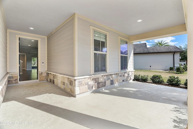 property entrance with a patio area