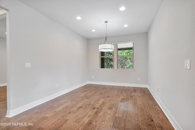 spare room featuring hardwood / wood-style flooring