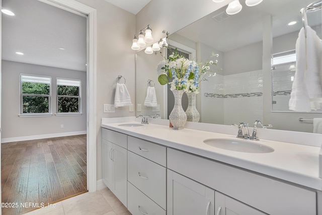 bathroom featuring vanity and a shower