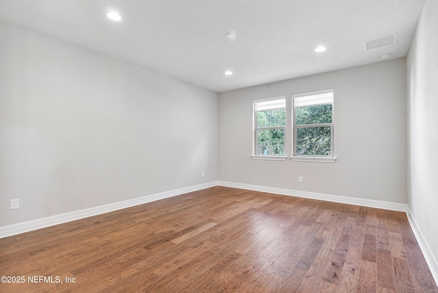 empty room featuring hardwood / wood-style floors