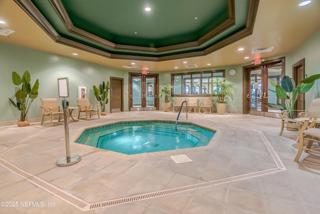 view of pool with french doors