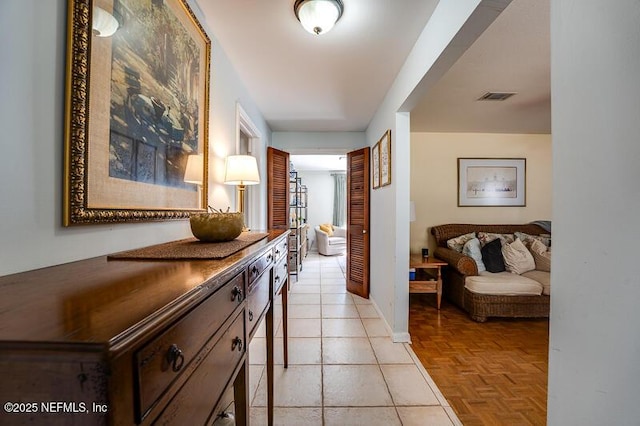 corridor featuring light parquet flooring