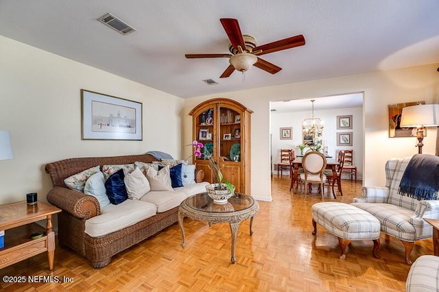 living room featuring ceiling fan and light parquet floors