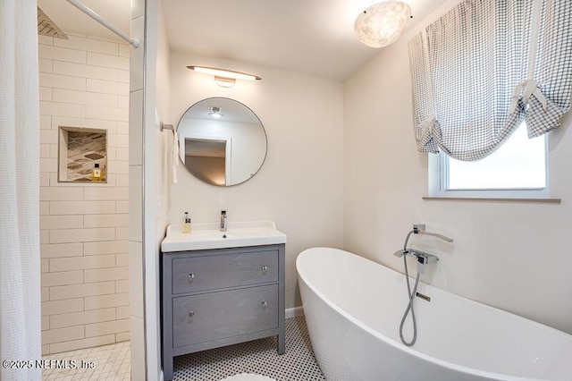 bathroom featuring independent shower and bath and vanity