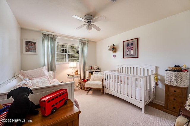 bedroom with light carpet and ceiling fan