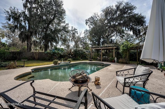 view of pool with a patio and an outdoor fire pit