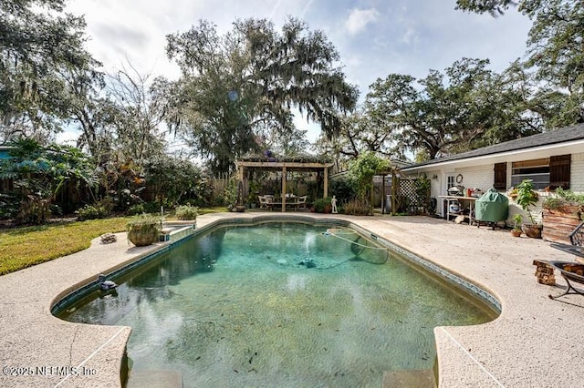 view of pool with a pergola and a patio area