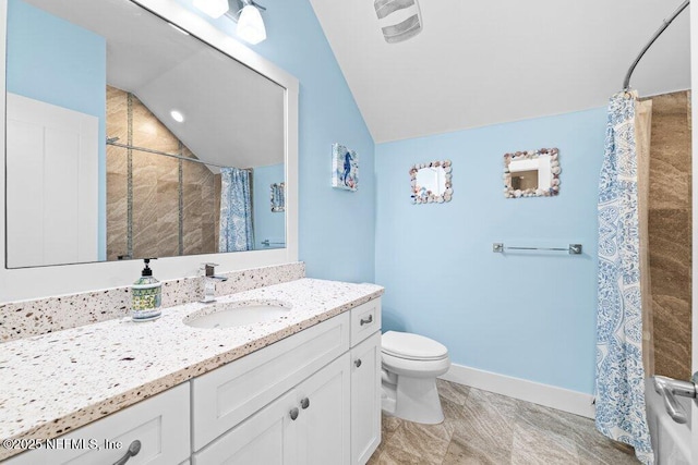 bathroom featuring vanity, lofted ceiling, curtained shower, and toilet