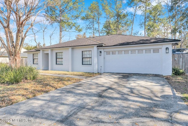 single story home with a garage