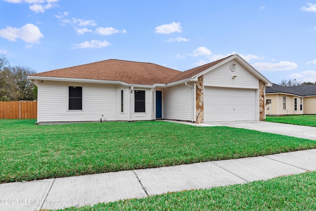 ranch-style home with concrete driveway, fence, a garage, stone siding, and a front lawn