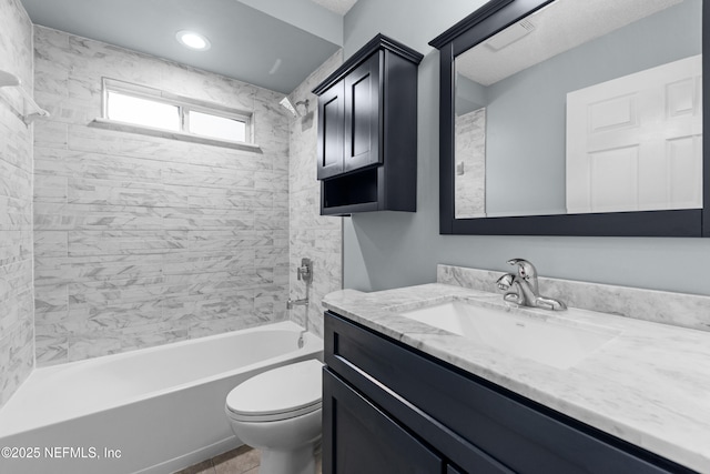 bathroom featuring toilet, shower / tub combination, and vanity