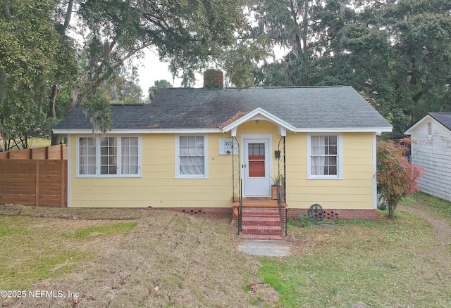 bungalow with a front yard