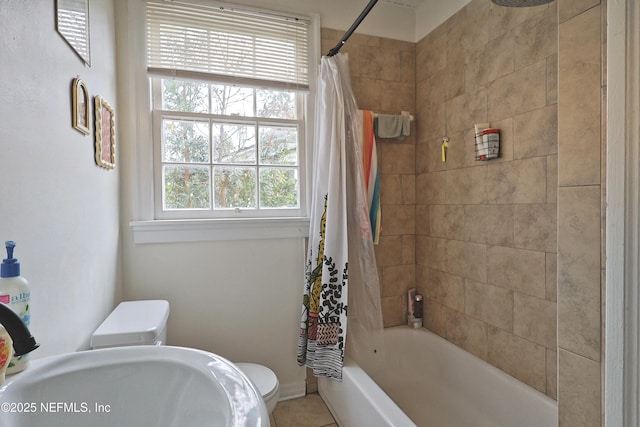 full bathroom with sink, shower / bath combination with curtain, and toilet