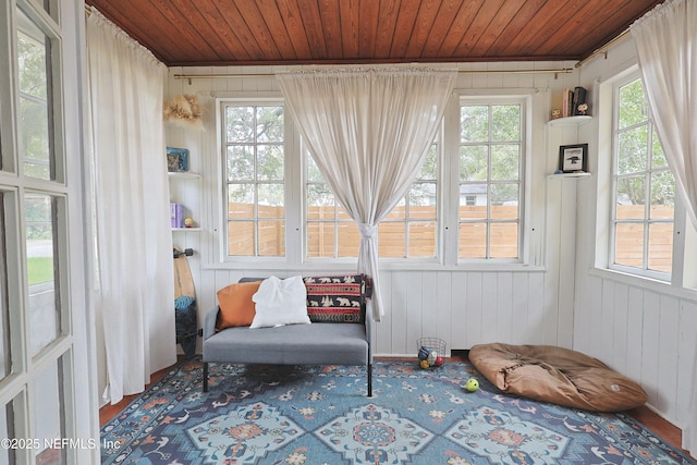 sunroom featuring a wealth of natural light and wooden ceiling