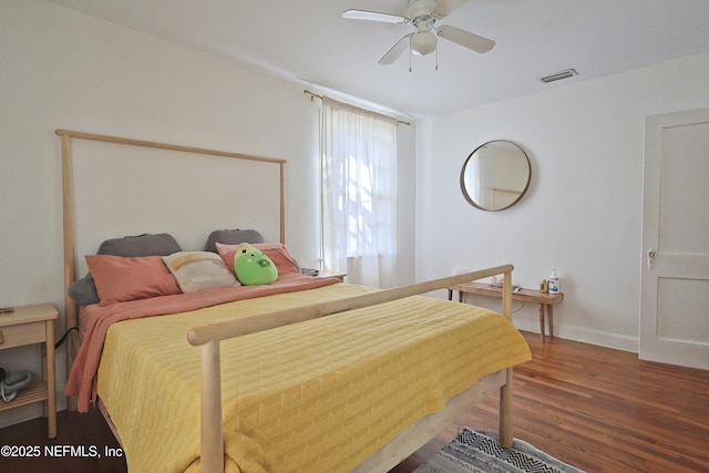 bedroom featuring dark hardwood / wood-style flooring and ceiling fan