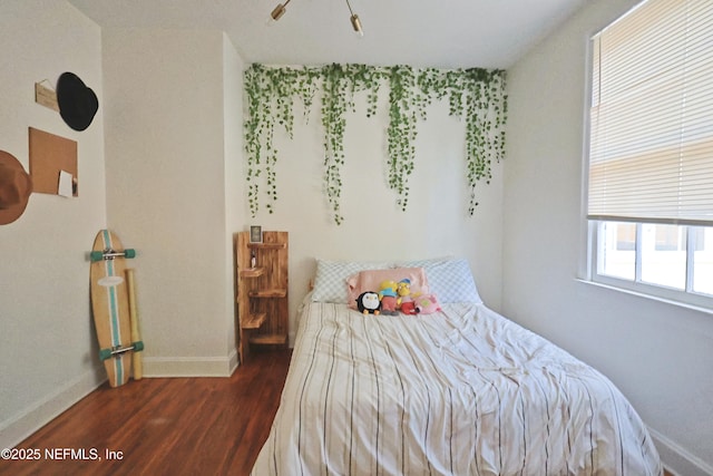 bedroom featuring dark hardwood / wood-style floors