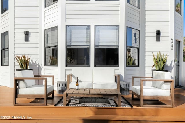 wooden deck with outdoor lounge area