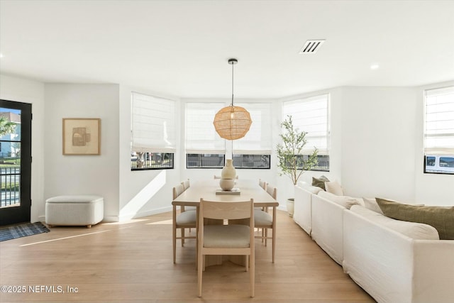 dining area with light hardwood / wood-style flooring