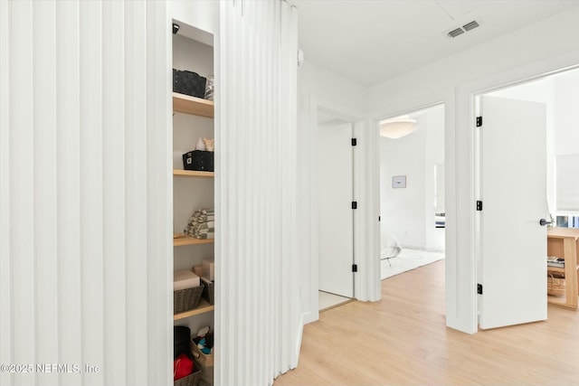 hallway featuring light wood-type flooring