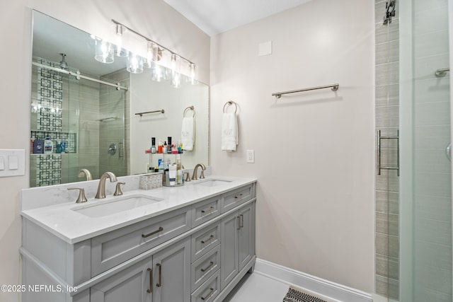 bathroom with vanity and a shower with door