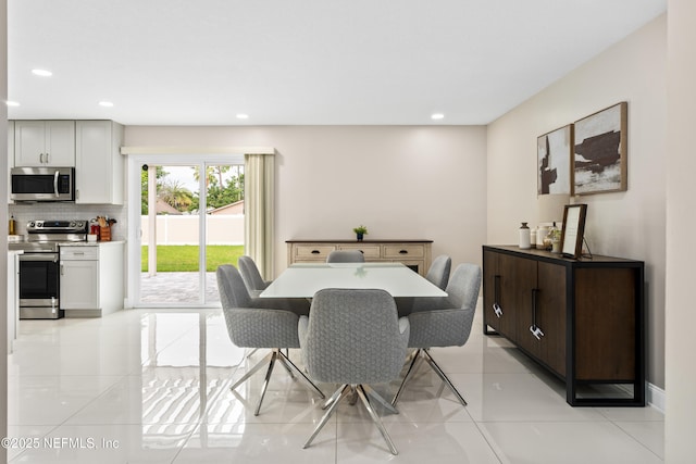 dining area with light tile patterned floors