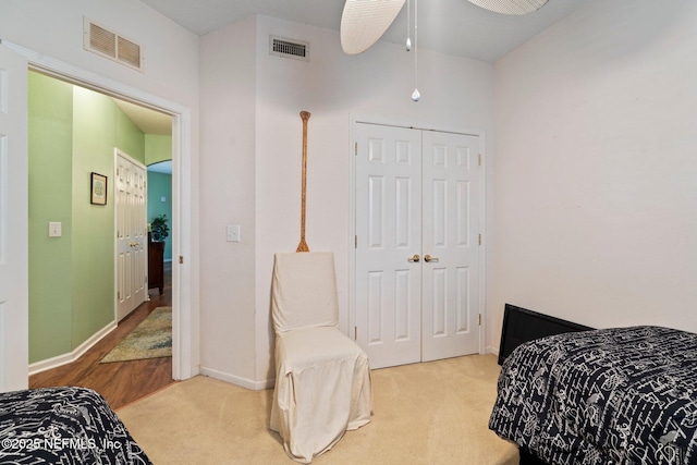 carpeted bedroom featuring a closet