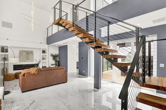 living room with a high ceiling